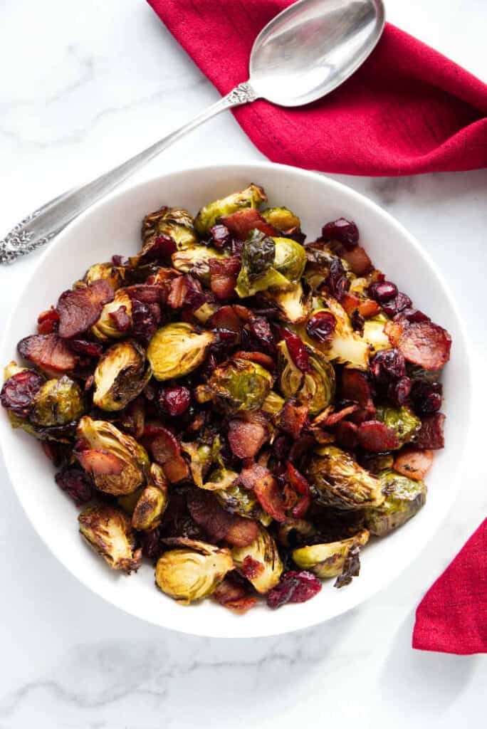 Overhead photo of air fryer Brussels sprouts with a serving spoon