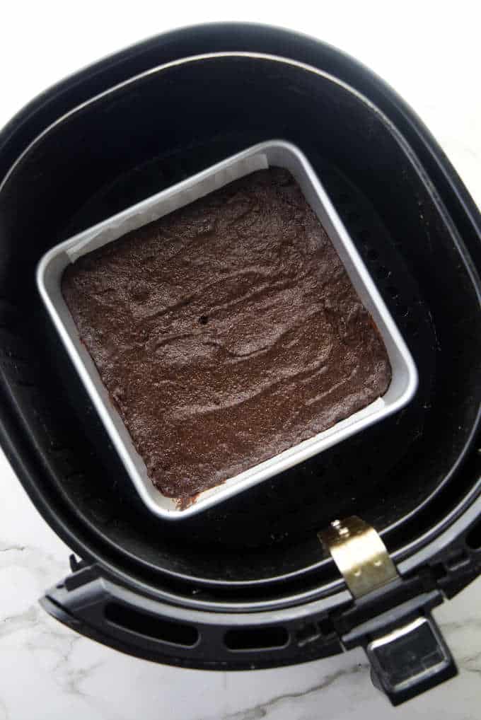 A pan of brownies in an air fryer basket.