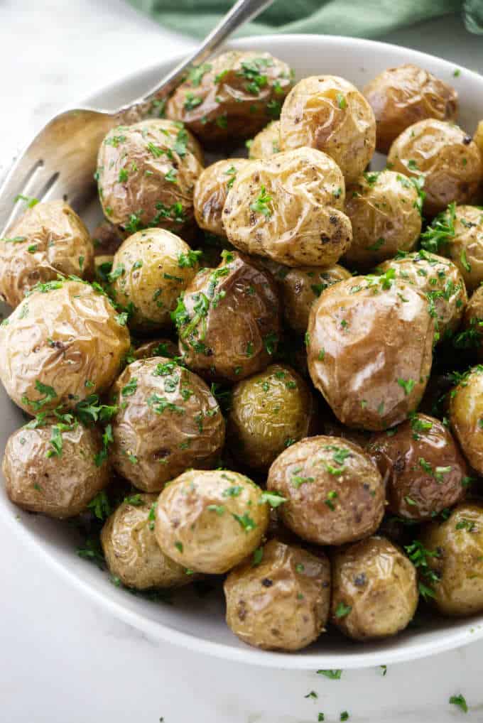 Baby potatoes with butter and chopped parsley.