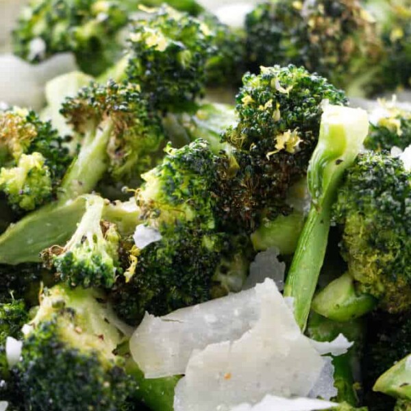 Close up of broccoli with parmesan and lemon.