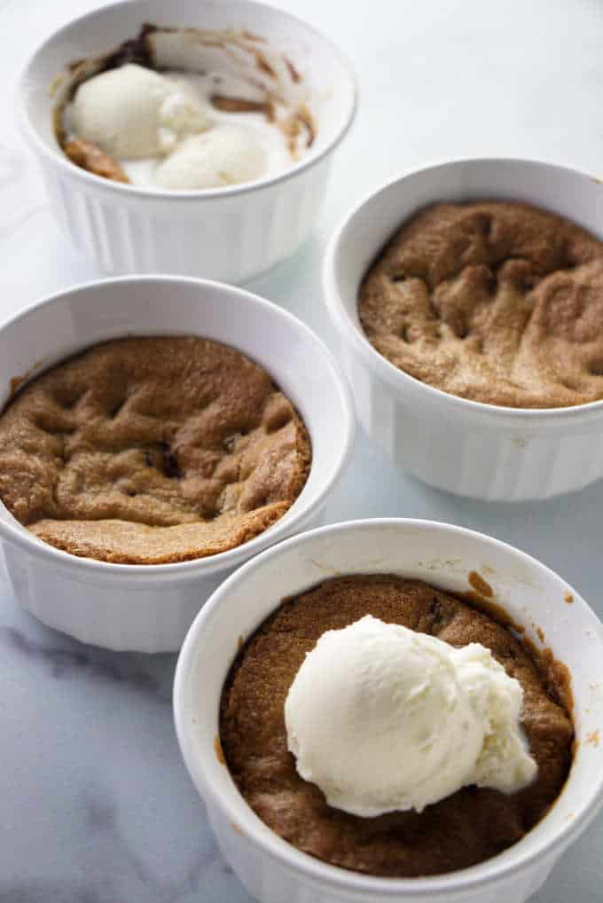 4 deep dish cookie bowls with ice cream.