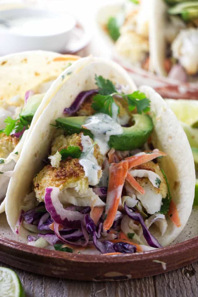 A plate of tilapia fish tacos with slaw.