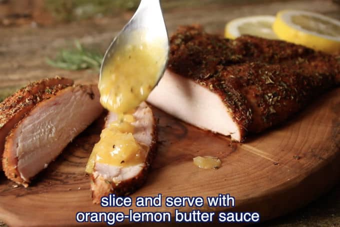 slicing the smoked wild turkey breast and drizzling the orange-lemon butter sauce on top