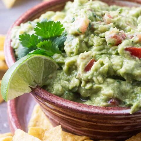 Completed recipe of guacamole with tomatoes and pepperoncini