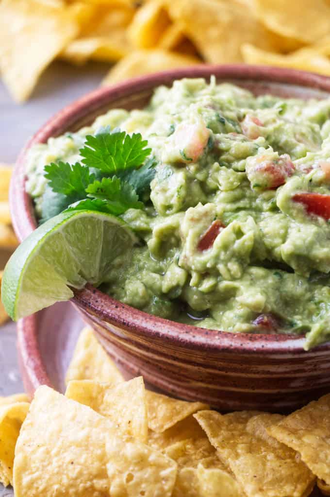 Completed recipe of guacamole with tomatoes and pepperoncini