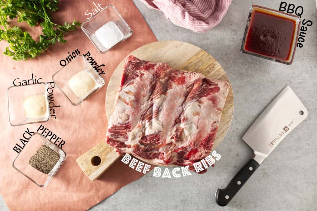 Air fryer beef back ribs ingredients: bbq sauce, salt, onion powder, garlic powder, black pepper, and beef back ribs