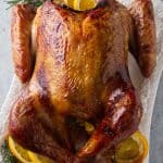 Bourbon brined Traeger turkey with a golden glaze from a brown sugar bourbon glaze.