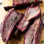 Smoked beef plate short ribs showing the smoke ring after being sliced.