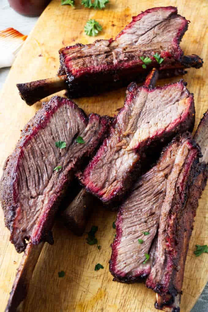 Smoked beef plate short ribs showing the smoke ring after being sliced.