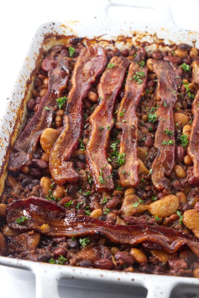 Cowboy baked beans fresh out of the oven with bacon on top.
