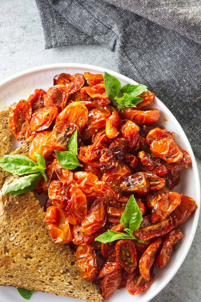 A plate of air fryer cherry tomatoes with toast.