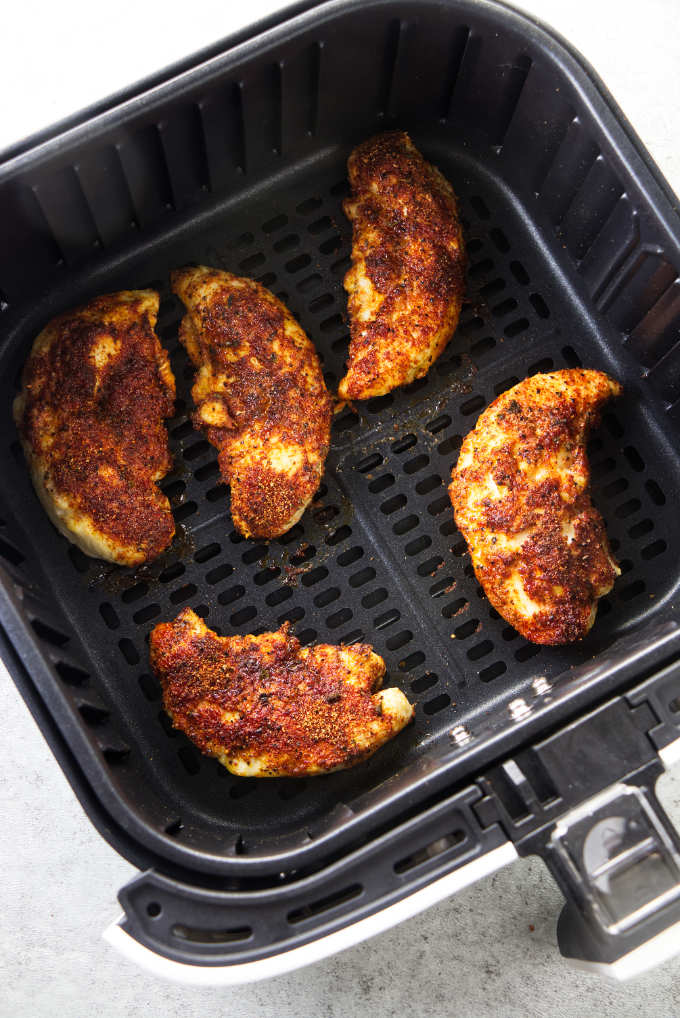 Chicken tenderloins baked in an air fryer.