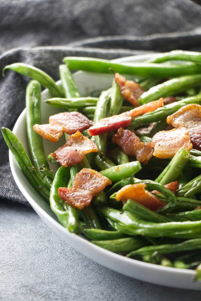 A serving of green beans with bacon.