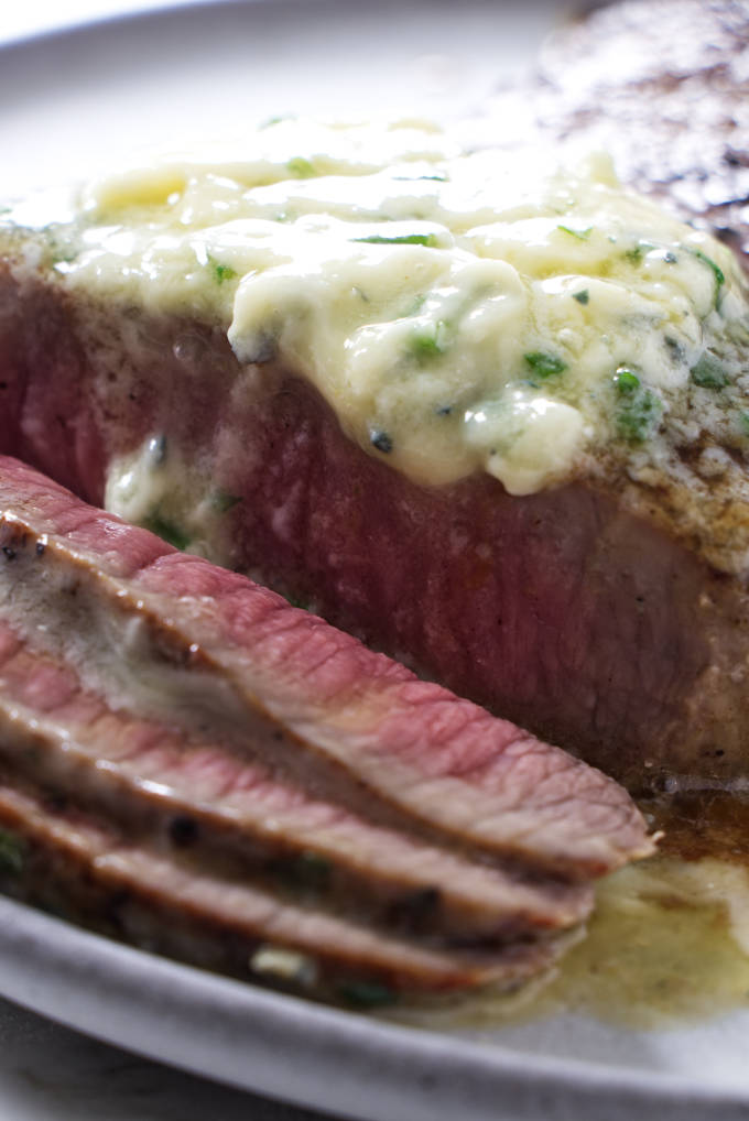 Blue cheese butter melting on a steak.