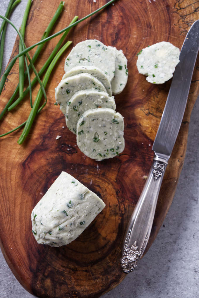 A log of blue cheese butter sliced into rounds for steak.