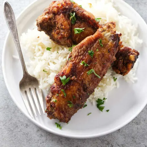 Turkey wings on a bed of rice.