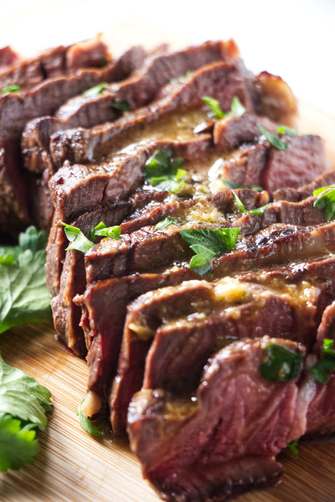 A marinated steak sliced and ready to eat.