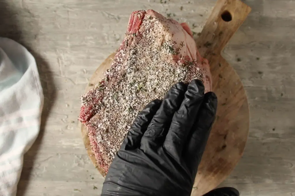 Process photo showing dry rub on the prime rib