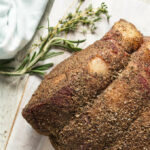 Traeger smoked prime rib resting on cutting board