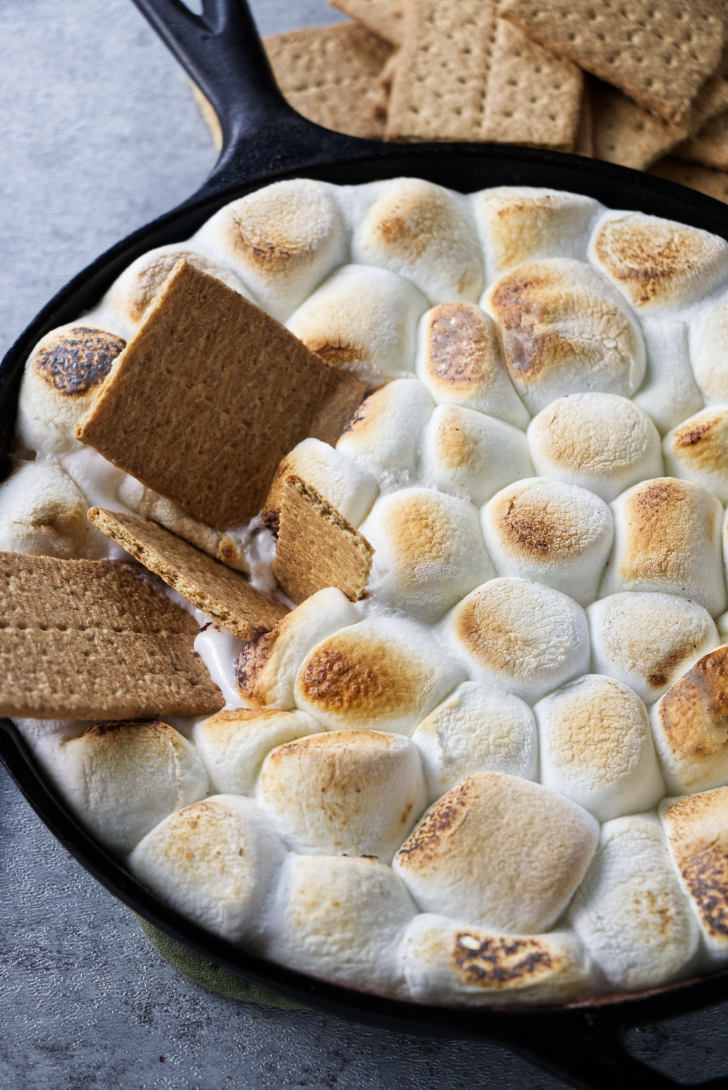 A cast iron skillet with s'mores dip.
