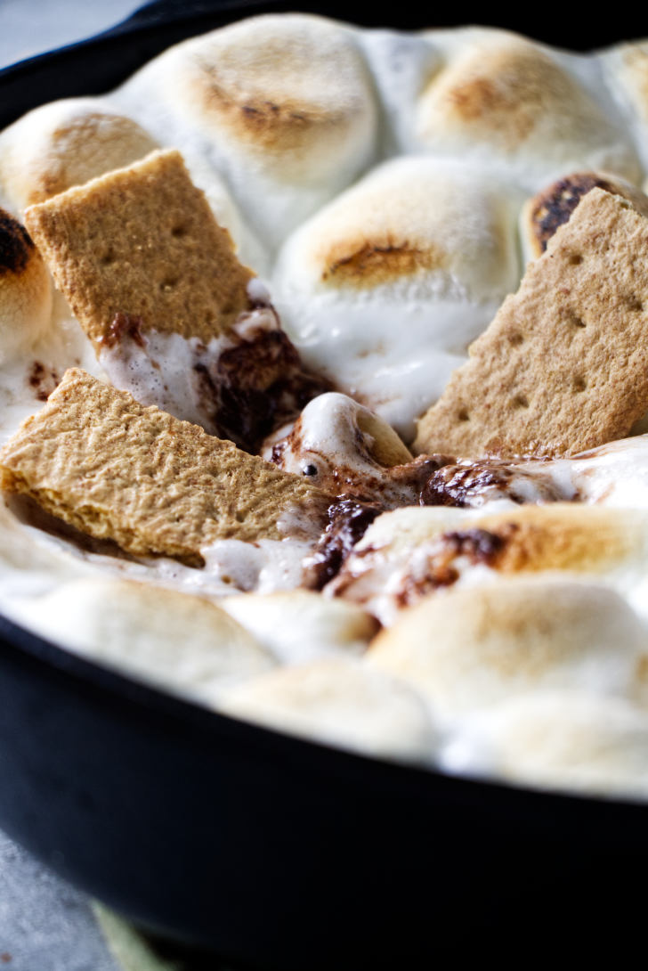 S'mores dip with Graham crackers dipped inside.