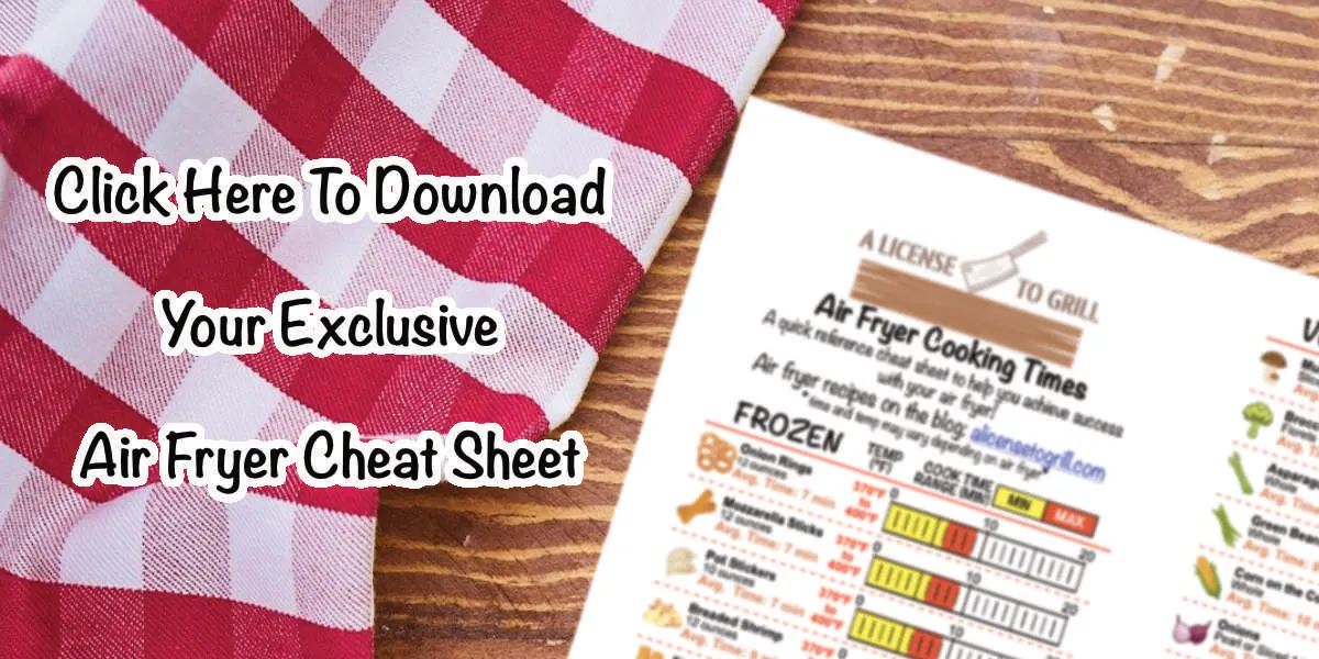 air fryer cheat sheet preview sitting on wood desk with text "click here to download your exclusive air fryer cheat sheet"