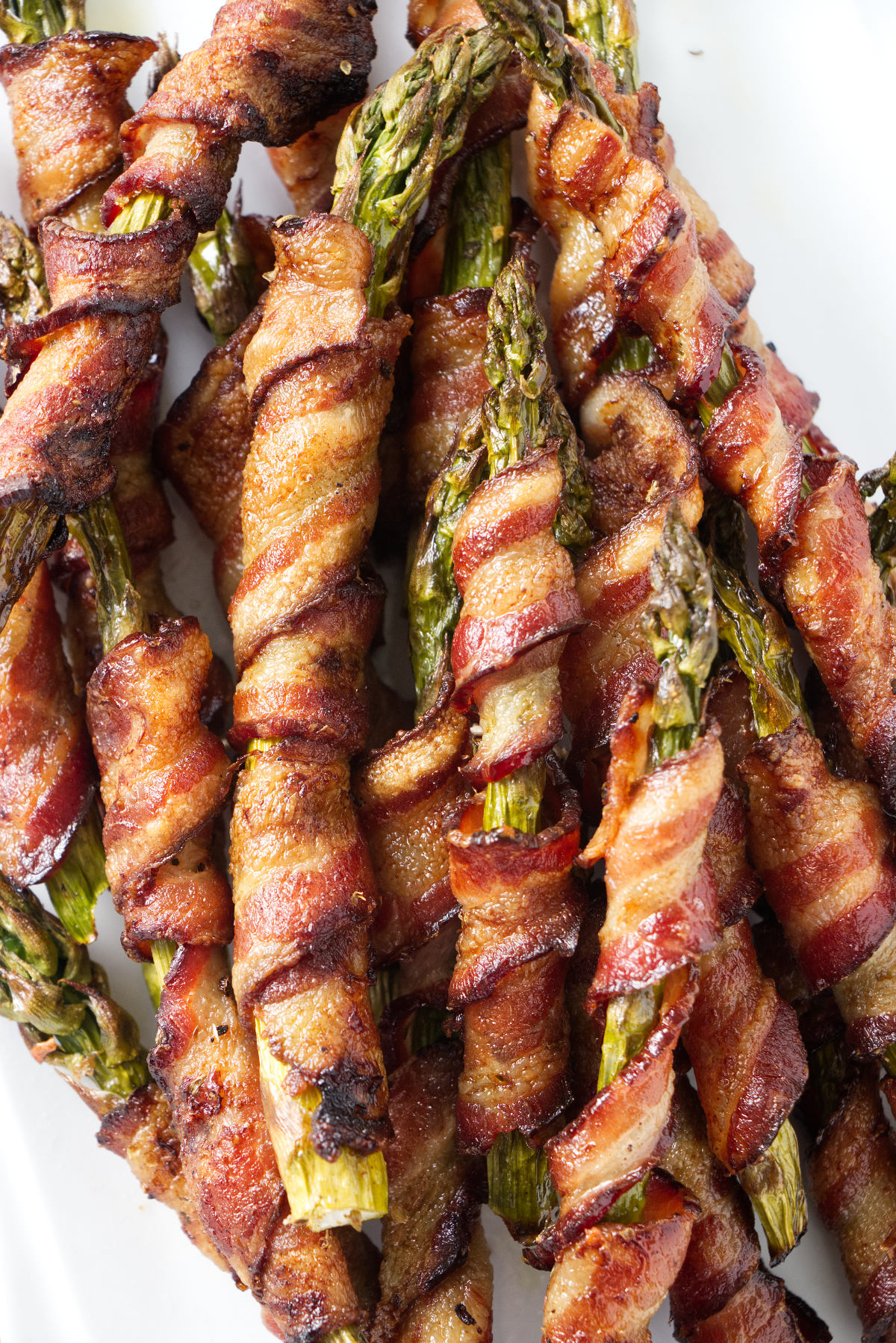 A pile of smoked bacon wrapped asparagus.