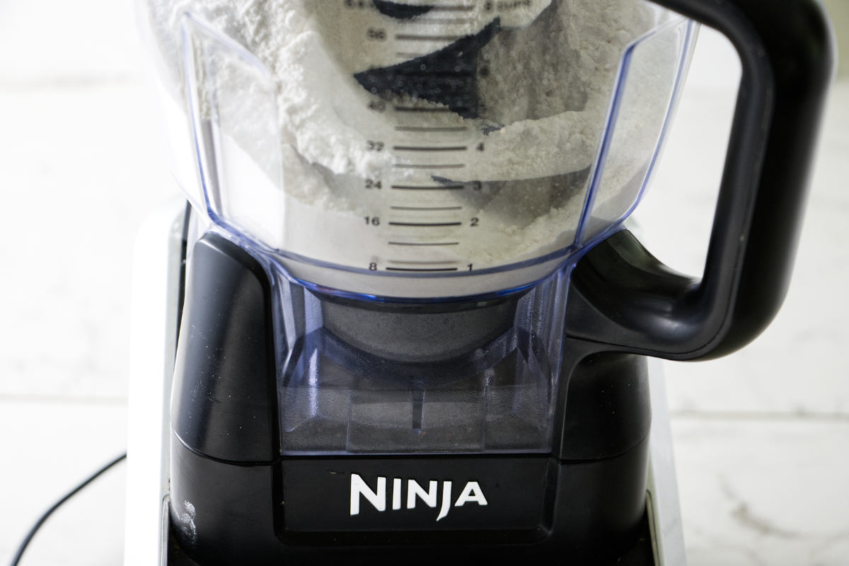 Blending ingredients in a Ninja food processor.
