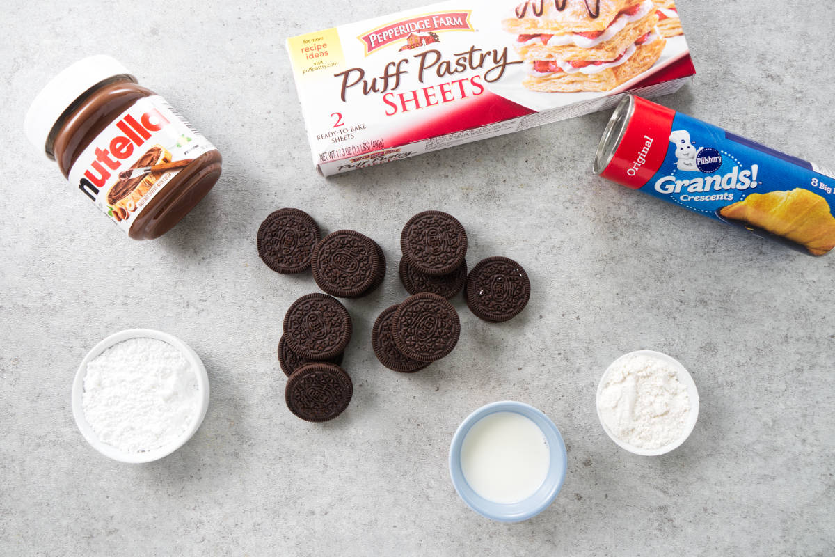 ingredietns for air fried oreos: puff pastry, crescent rolls, oreos, nutella, powdered sugar, milk, flour.