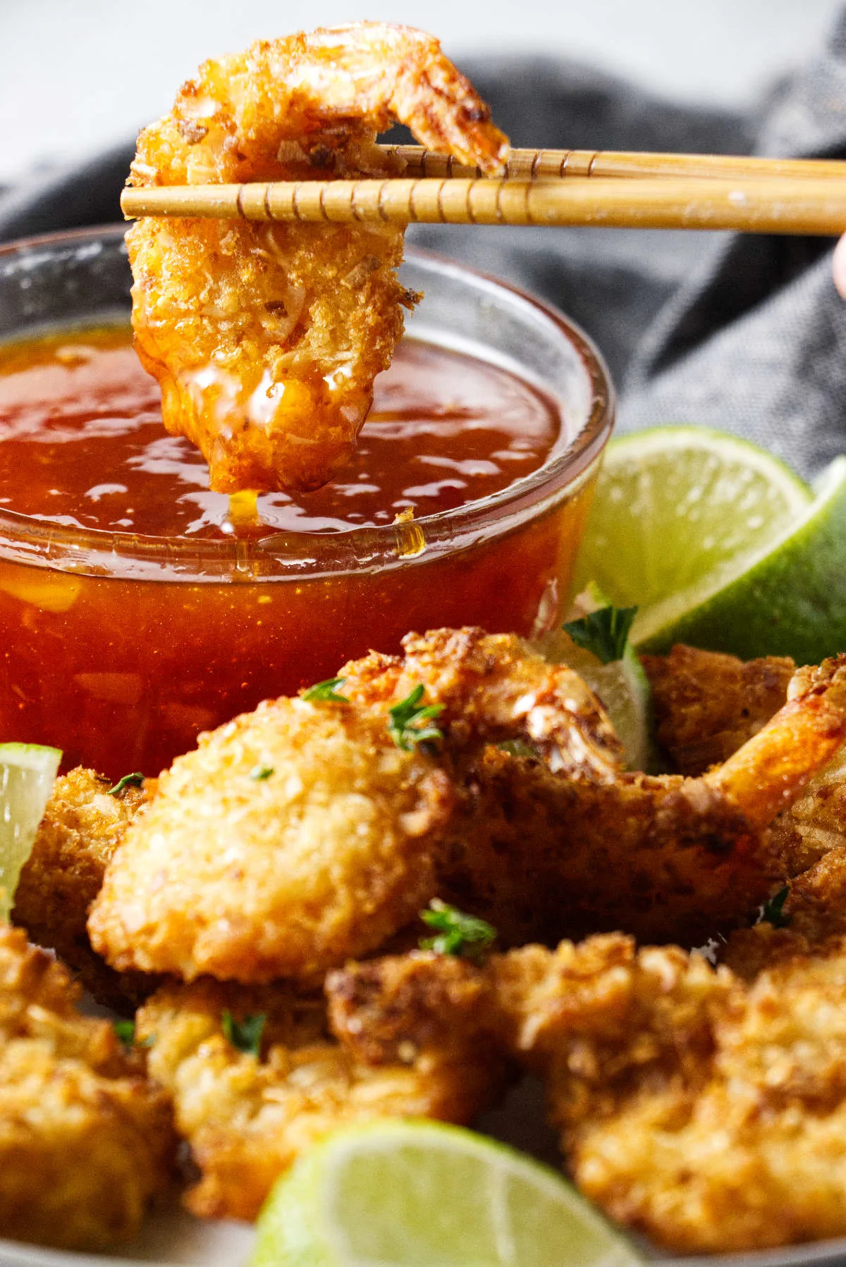 Dipping a shrimp in sweet chili sauce.