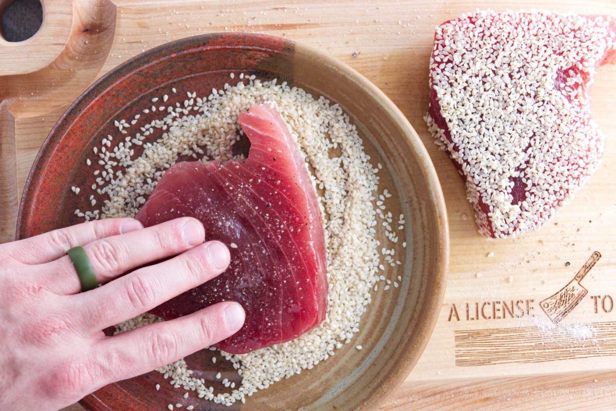 coating tuna steaks in sesame seeds