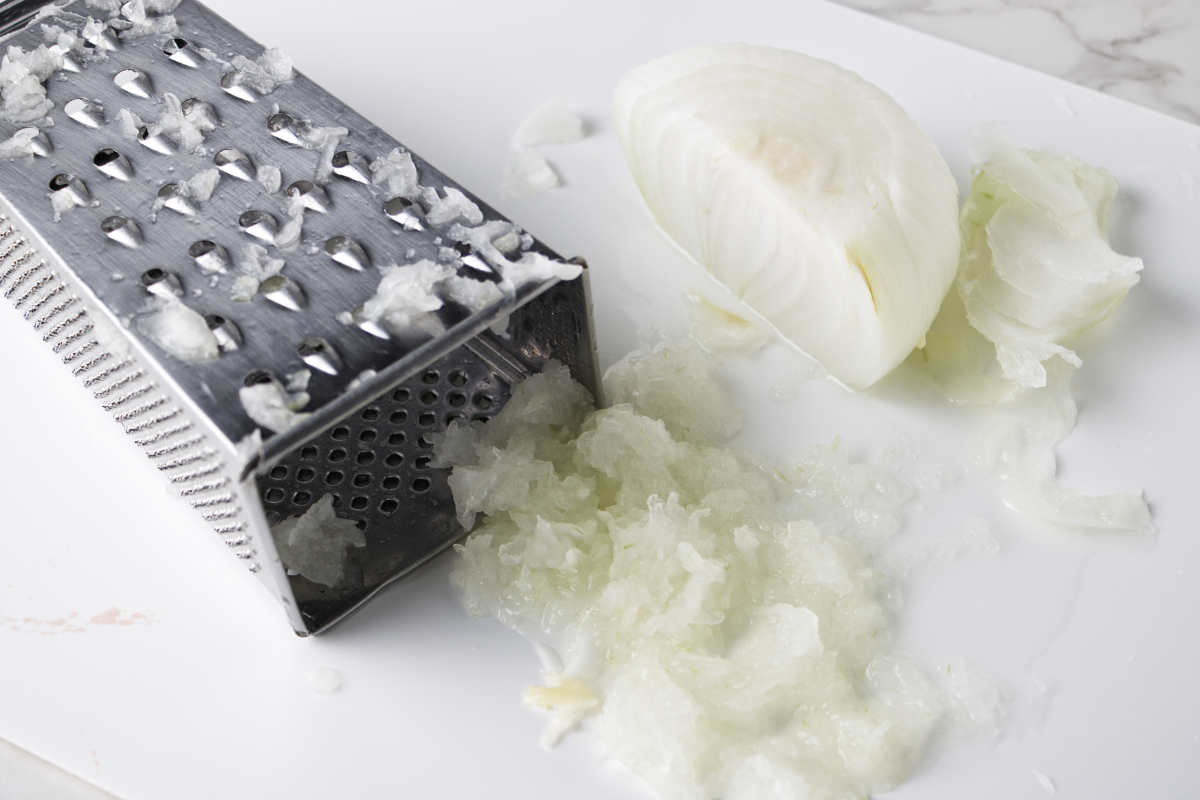 White onion being grated.