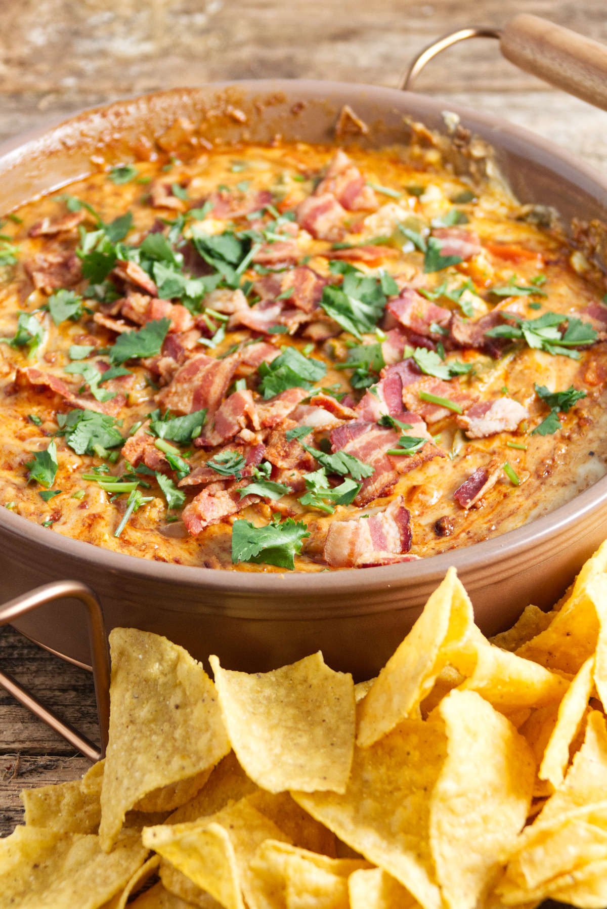 large bowl of queso dip and chips for dipping