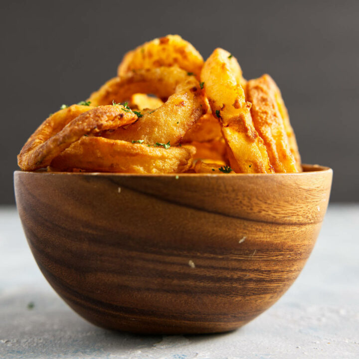 onion rings in wooden bowl