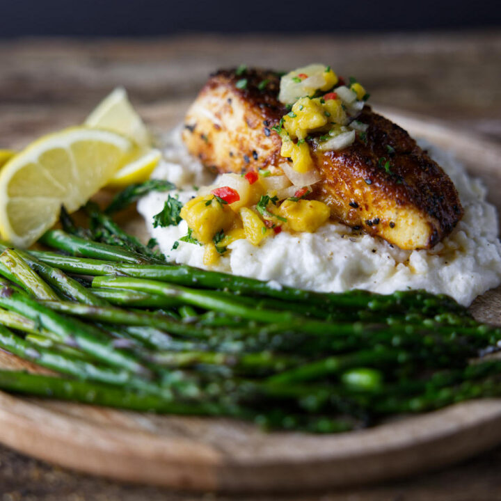 cooked halibut fillet topped with mango salsa