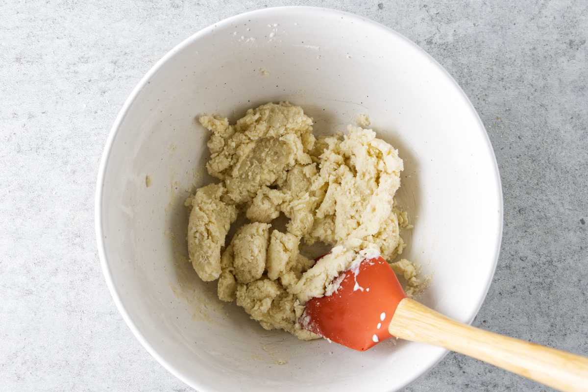 mixing dry ingredients of biscuit topping of cobbler