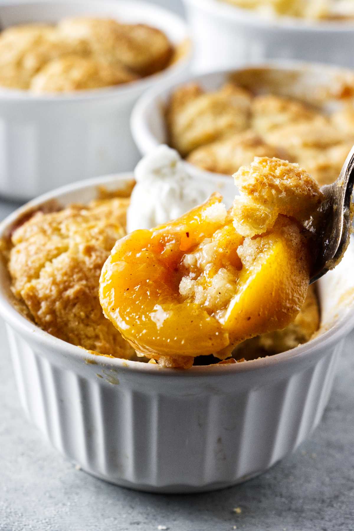 close up of air fryer peach cobbler