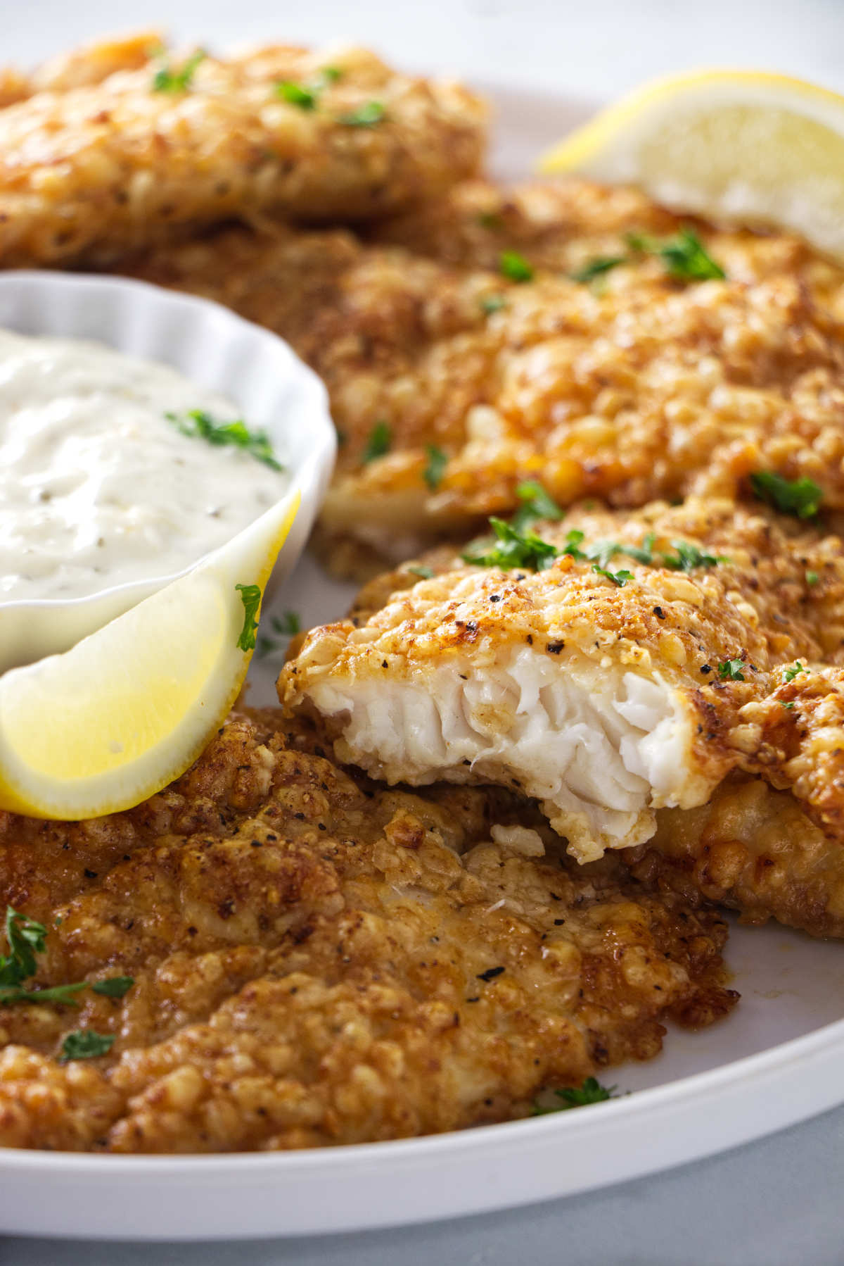 Air fryer tilapia on a serving plate.