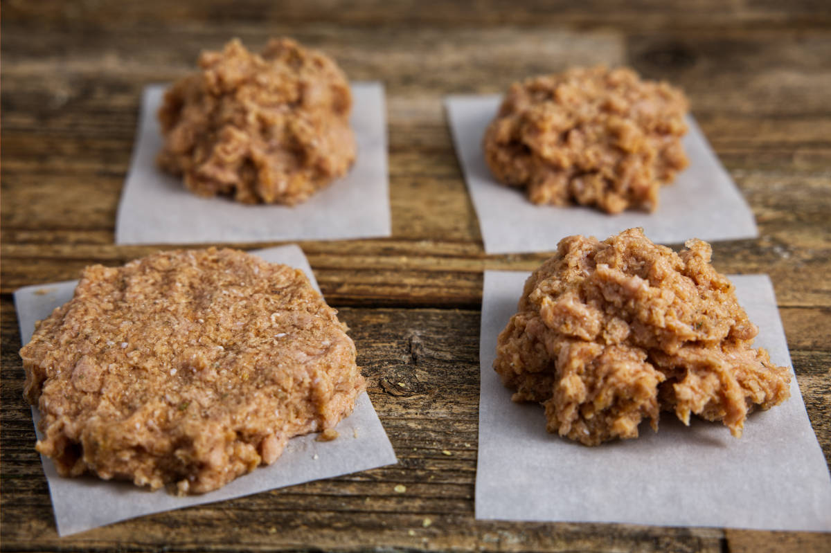 Forming turkey burger patties into equal portions.