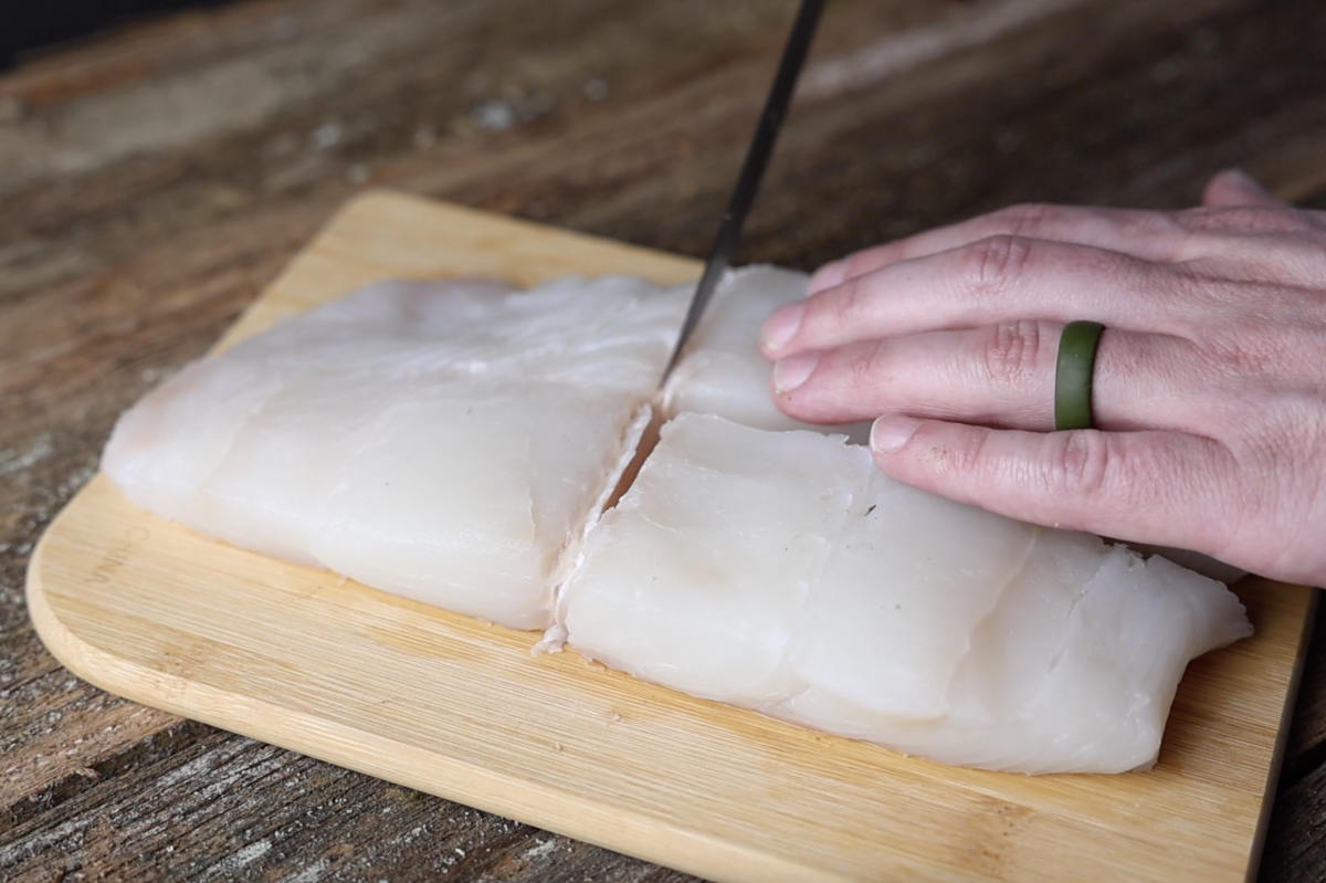 cutting halibut fillet into portions