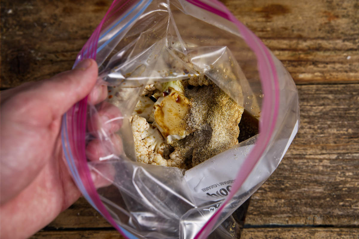 cauliflower in plastic bag with marinade ingredients