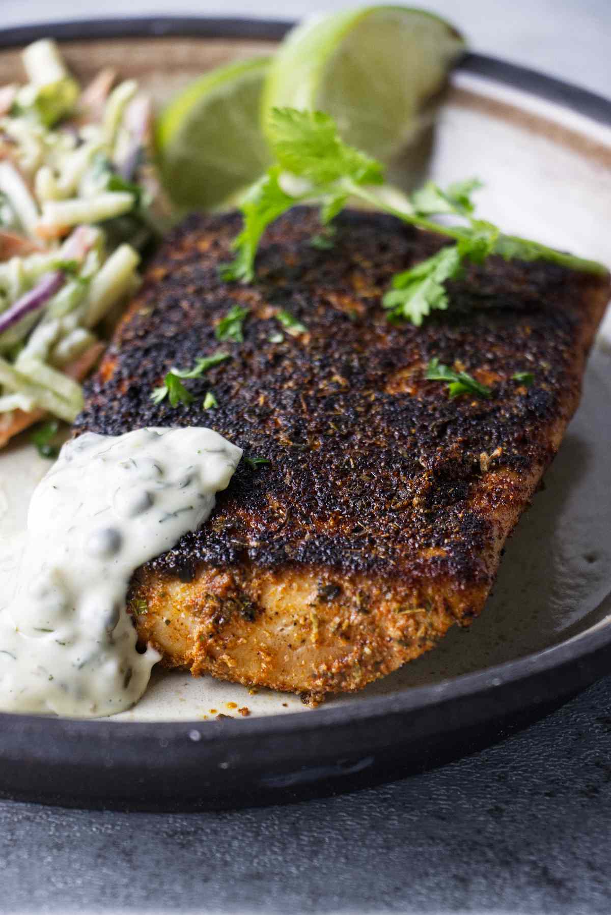 air fryer blackened mahi mahi plated with dill caper sauce