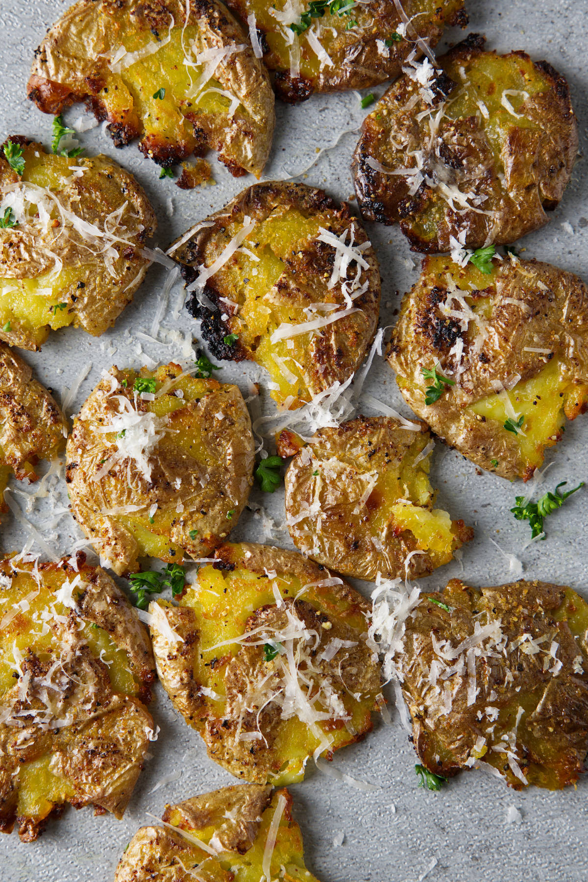 air fryer smashed potatoes laying on the counter