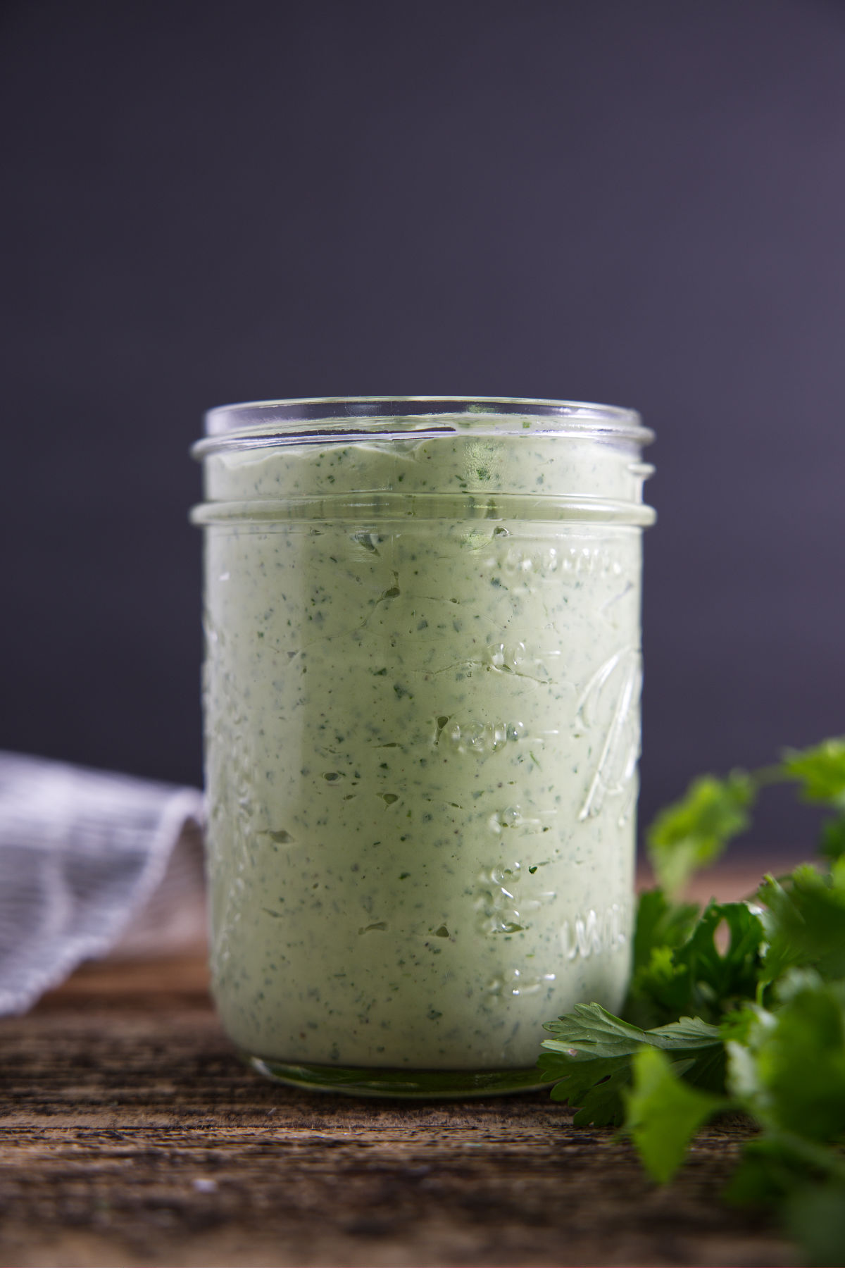 Jar full of avocado crema sauce.