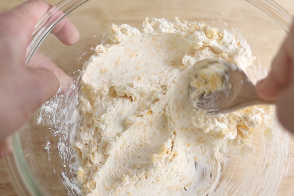 Mixing cheese filling mixture for jalapeno poppers.