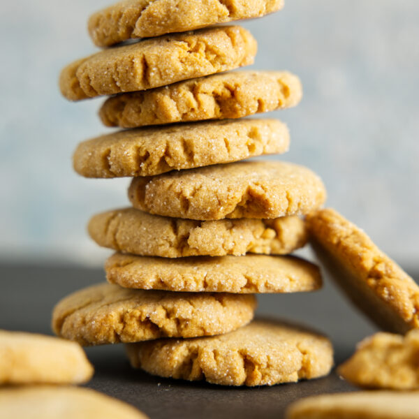 A huge stack of air fryer peanut butter cookies, about to tumble over.