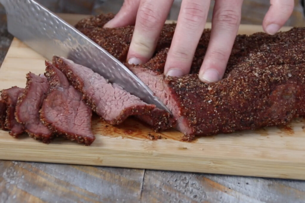 Thinly slicing smoked tri-tip.