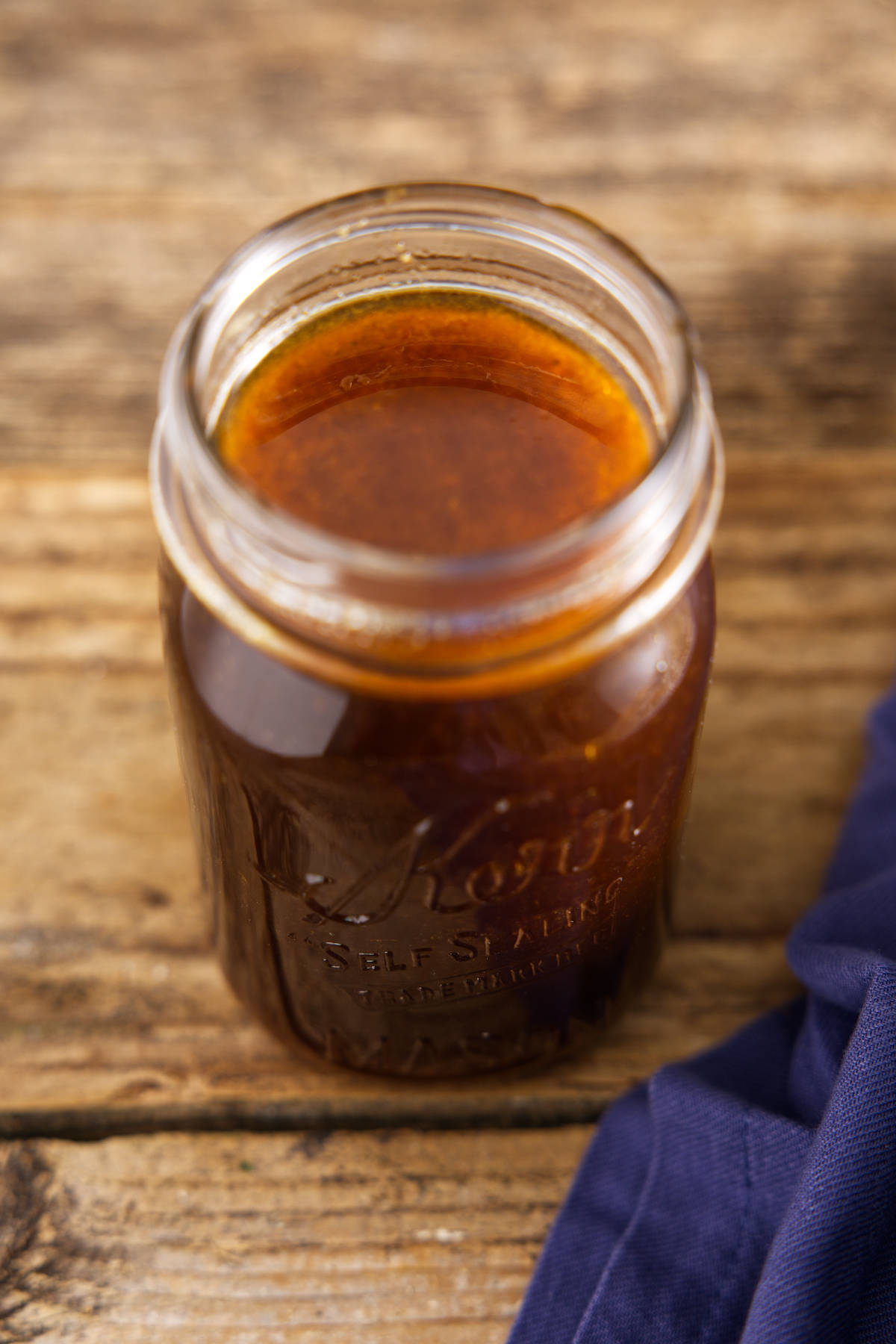 Glass Mason jar filled with pork loin marinade.