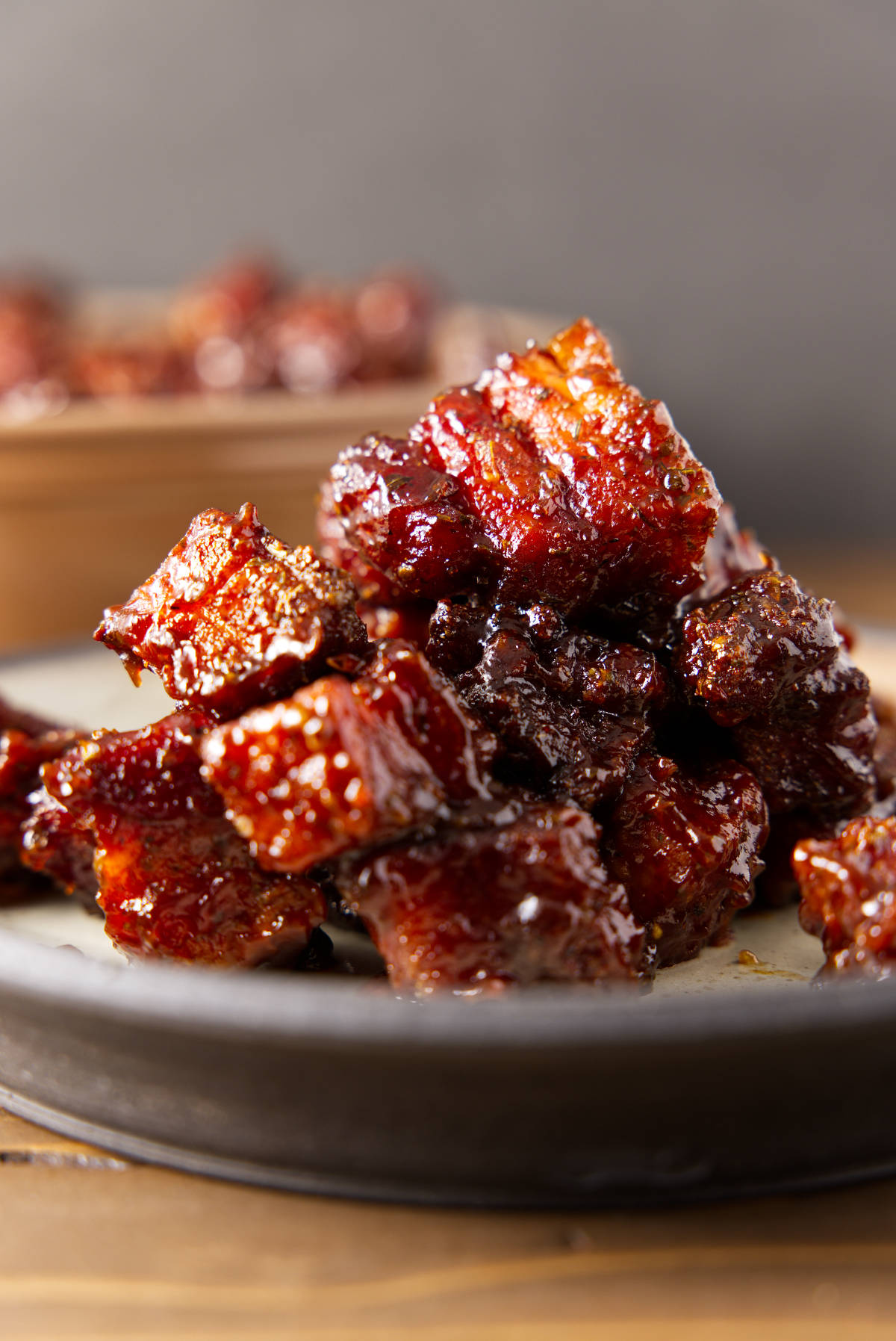 Pile of pork belly burnt ends on a plate.