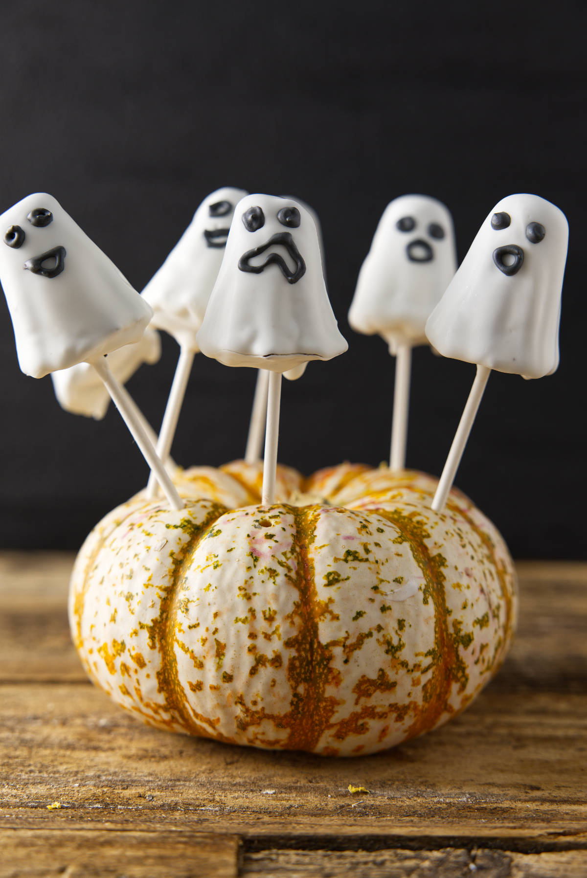 Ghost cake pops in pumpkin.